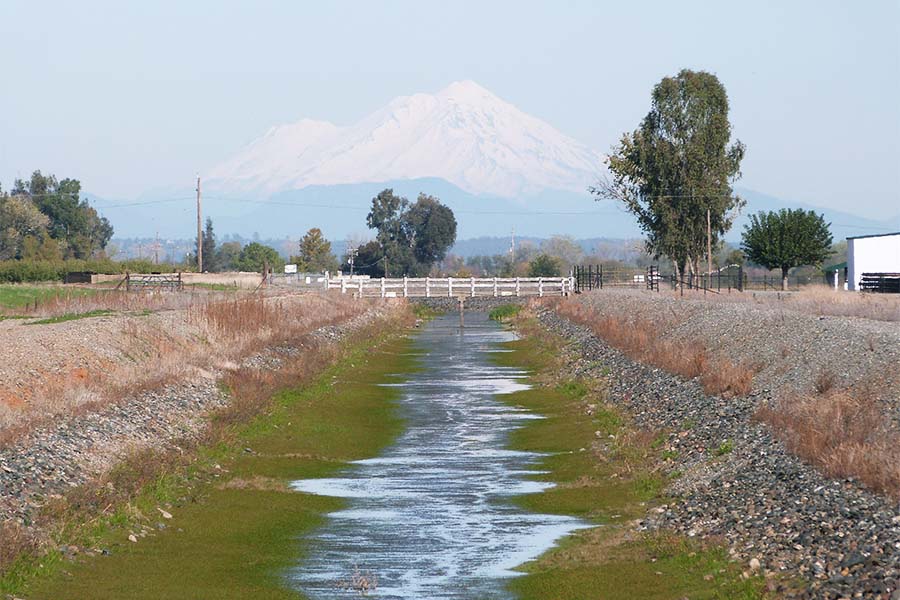 View of a water canal with Mt. Shasta in the background